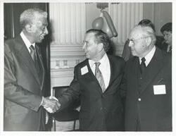 ["Black and white photograph print of Carl Albert with unidentified people at his birthday party, 1976"]