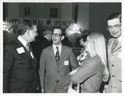 ["Black and white photograph print of Carl Albert with unidentified people at his birthday party, 1976"]