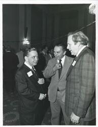 ["Black and white photograph print of Carl Albert with unidentified people at his birthday party, 1976"]