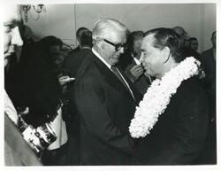 ["Black and white photograph print of Carl Albert speaking with an unidentified man at his birthday party. May 10, 1974"]