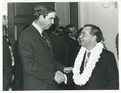 ["Black and white photograph print of Carl Albert shaking hands with George Mahon at Albert's birthday party. May 10, 1974"]