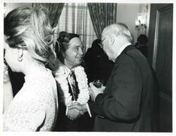 ["Black and white photograph print of Carl Albert shaking hands with an unidentified man at his birthday party. May 10, 1974"]
