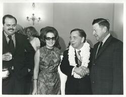 ["Black and white photograph print of Carl Albert shaking hands with an unidentified man at his birthday party. May 10, 1974"]