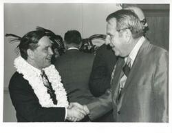["Black and white photograph print of Carl Albert shaking hands with John N. Happy Camp at his birthday party. May 10, 1974"]