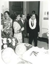 ["Black and white photograph print of Carl Albert standing with Jane England Lawton, Jan Lipsen and others at his birthday party. May 10, 1974"]