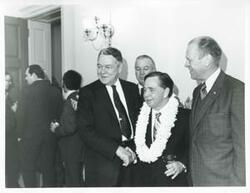 ["Black and white photograph print of Hale Boggs, Carl Albert, and Gerald R. Ford at Albert's birthday party. May 10, 1974"]