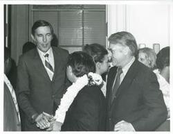 ["Black and white photograph print of Carl Albert, Morris Udall, and others at Albert's birthday party. May 10, 1974"]