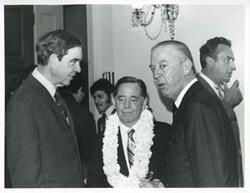 ["Black and white photograph print of Carl Albert speaking with George Mahon and another man at his birthday party. May 10, 1974"]