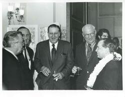 ["Black and white photograph print of Carl Albert, Mike Mansfield, and others talking at Albert's birthday party. May 10, 1974"]