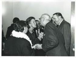 ["Black and white photograph print of Carl Albert with unidentified people at Albert's birthday party. May 10, 1974"]