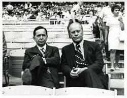 ["Black and white photograph print of Carl Albert and Gerald R. Ford seated at congressional ball game. 1972+N2716"]