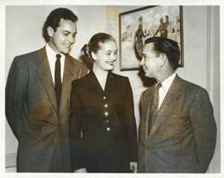 ["Black and white photograph print of Carl Albert with unidentified people."]