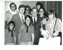 ["Black and white photograph print of Carl Albert with unidentified people."]