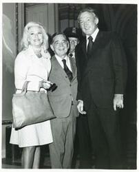 ["Black and white photograph print of Ginger Rogers, Carl Albert, and James Mann."]