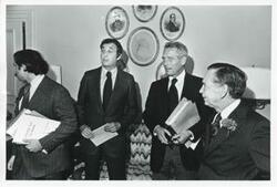 ["Black and white photograph print of Carl Albert speaking with Paul Newman and two unidentified men."]