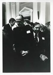 ["Black and white photograph print of Carl Albert speaking with Daniel Flood."]