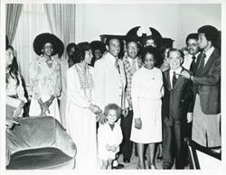 ["Black and white photograph print of Arthur Ashe, Andrew Young, Louise Butler, Shirley Jeter, and others. Carl Albert is included. 1975"]