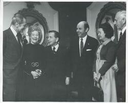 ["Black and white photograph print of Carl Albert posing with several unidentified people at the National Prayer Breakfast. February 2, 1971"]