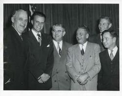 ["Black and white photograph print of Robert S. Kerr, Billy Graham, Tom Steed, Toby Morris, A. S. Mike Monroney, and Carl Albert."]