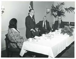 ["Black and white photograph print of Carl Albert, David Hall, Tom Steed, and an unidentified woman."]