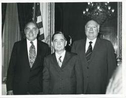 ["Black and white photograph print of Carl Albert, Gerald R. Ford, and three unidentified men posing for a picture. (Ford not pictured in 2809)."]