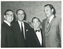 ["Black and white photograph print of Carl Albert, Gerald R. Ford, and three other men."]
