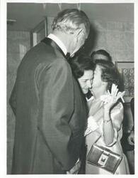 ["Black and white photograph print of Lyndon B. Johnson, Lady Bird Johnson and Mary Albert speaking to one another."]