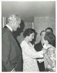 ["Black and white photograph print of Lyndon B. Johnson, Lady Bird Johnson and Mary Albert speaking to one another."]