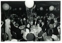["Black and white photograph print of several people at a fund raising dinner sponsored by the Democratic National Committee. May 1971"]