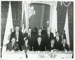 ["Black and white photograph print of Page Belcher, Ed Edmondson, John Jarman, Victor Wickersham, and Carl Albert in back row. Seated are A. S. Mike Monroney, Tom Steed, J. Howard Edmondson, and two unidentified people."]