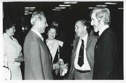["Black and white photograph print of Carl Albert and Mary Albert talking with two men. August 1975"]