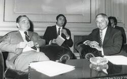 ["Black and white photograph print of Carl Albert seated with two other men during the House delegation trip. August 1975"]