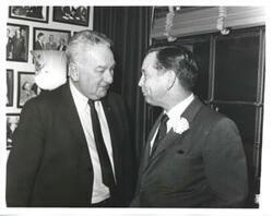 ["Black and white photograph print of Carl Albert speaking with Charles Halleck in an office. January 1963"]