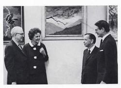 ["Black and white photograph print of Carl Albert, Tom Steed, Elliot Richardson, and an unidentified woman standing together in an art gallery."]