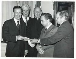 ["Black and white photograph print of Carl Albert and Thomas P. O'Neill standing with three unidentified men."]