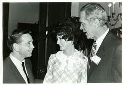 ["Black and white photograph print of Carl Albert speaking with G. V. Montgomery and the Maid of Cotton"]