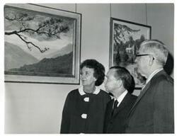 ["Black and white photograph print of Carl Albert and Tom Steed speaking with an unidentified man."]