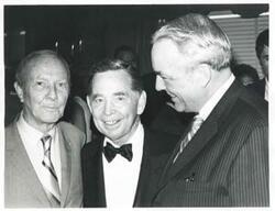 ["Black and white photograph print of Carl Albert posing with two unidentified men."]