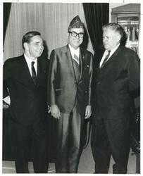 ["Black and white photograph print of Carl Albert and Olin Teague posing with an unidentified man."]