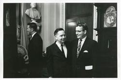 ["Black and white photograph print of Carl Albert standing with an unidentified man."]