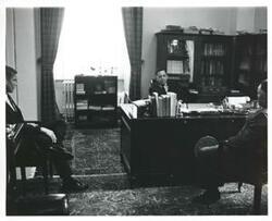 ["Black and white photograph print of Carl Albert with unidentified men."]