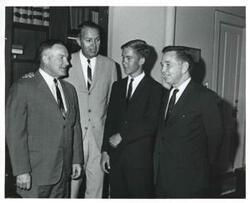 ["Black and white photograph print of Carl Albert with unidentified men."]