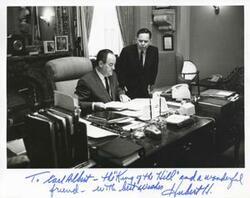 ["Black and white photograph print of Carl Albert and Hubert H. Humphrey in Humphrey's office."]