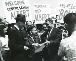["Black and white photograph print of Carl Albert at arrival at the Kansas City airport. August 1964"]