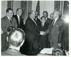 ["Black and white photograph print of Carl Albert with unidentified men."]