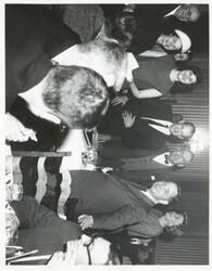 ["Black and white photograph print of Wright Patman, Lady Bird Johnson, Lynda Bird Johnson, Carl Albert, and several other people at an unidentified function. 3043 includes John McCormack."]