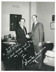 ["Black and white photograph print of Carl Albert shaking hands with Glenn M. Anderson."]
