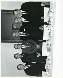 ["Black and white photograph print of Oklahoma delegation and others at a luncheon, L to R: Carl Albert, Fred Harris, Bruce Cafky, A. S. Mike Monroney, Tom Steed, and Ed Edmondson."]