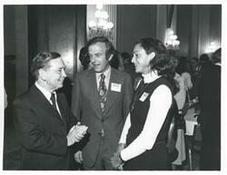 ["Black and white photograph print of Carl Albert speaking with an unidentified man and woman at the reception for freshman members of the 94th Congress. December 1, 1975"]