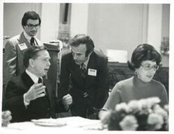 ["Black and white photograph print of Carl Albert speaking with an unidentified man at the reception for freshman members of the 94th Congress. December 1, 1975"]